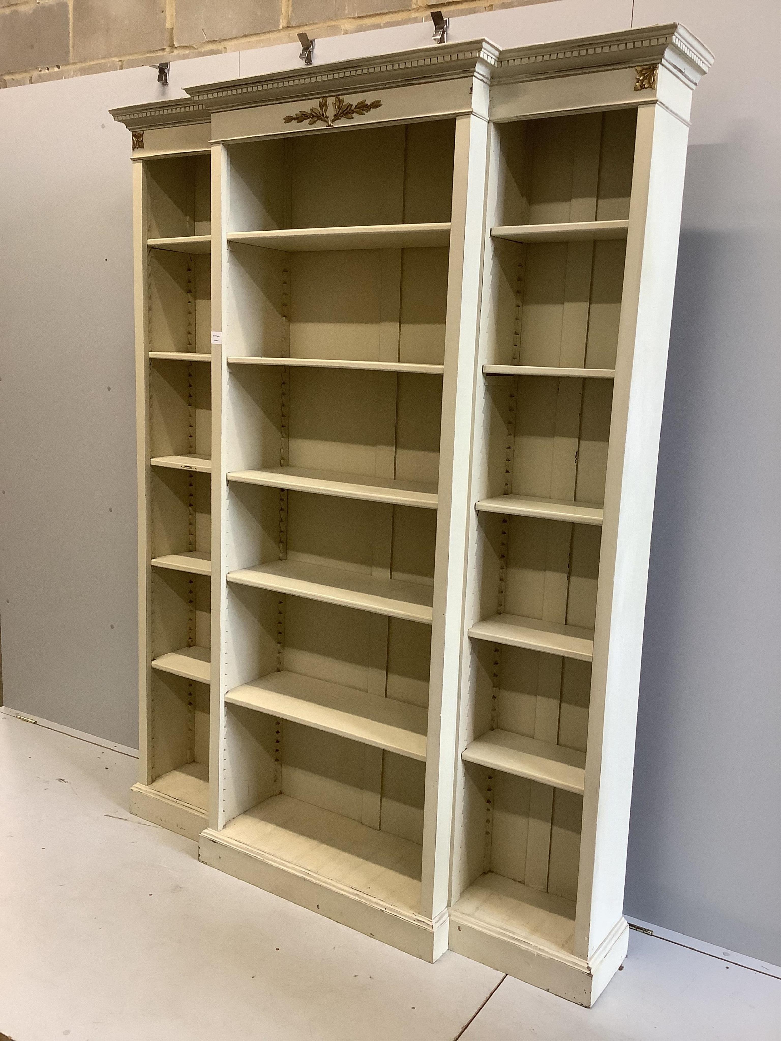 A George III style grey painted gilt metal mounted breakfront open bookcase, width 162cm, depth 36cm, height 213cm. Condition - fair